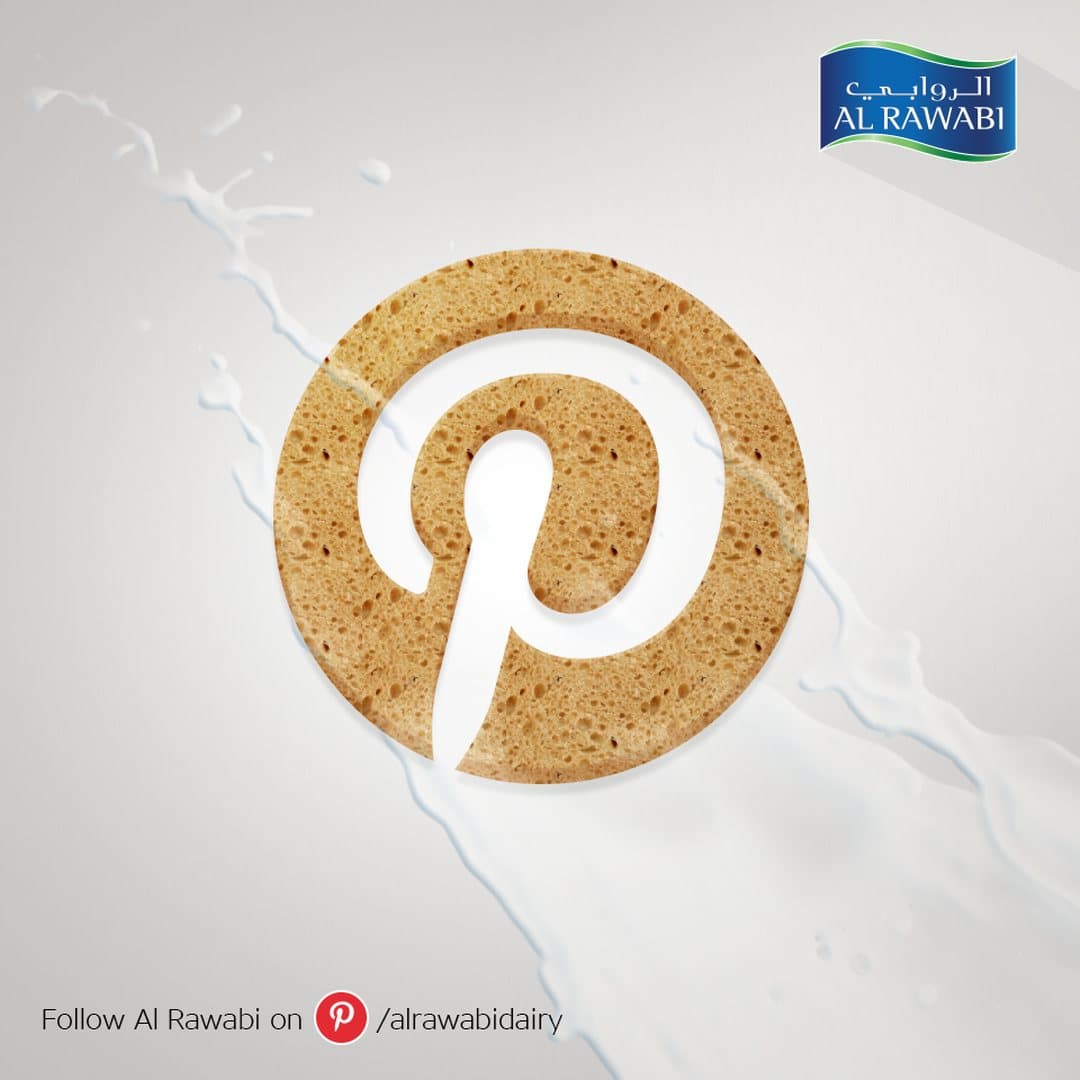 Pinterest logo cut from a baked biscuit texture with milk splashes, and a Follow Al Rawabi on Pinterest line