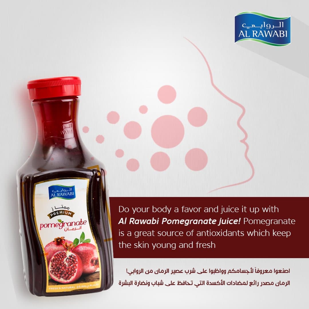 Pomegranate juice bottle with a soft line drawing of a face and dots, with a bilingual caption about skin